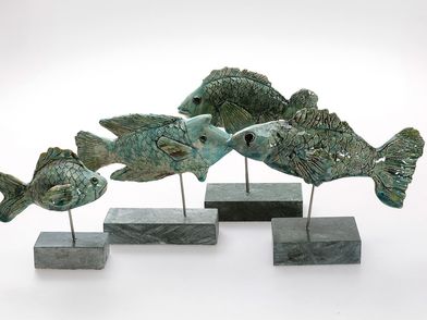 Vier Fische aus Keramik